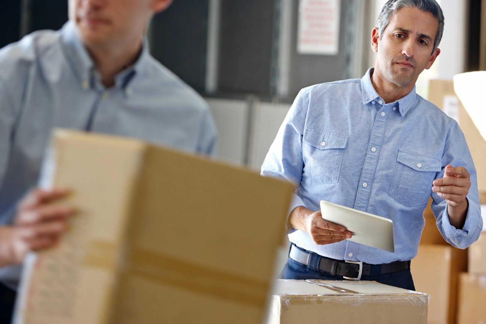 A logistics person double-checking a delivery